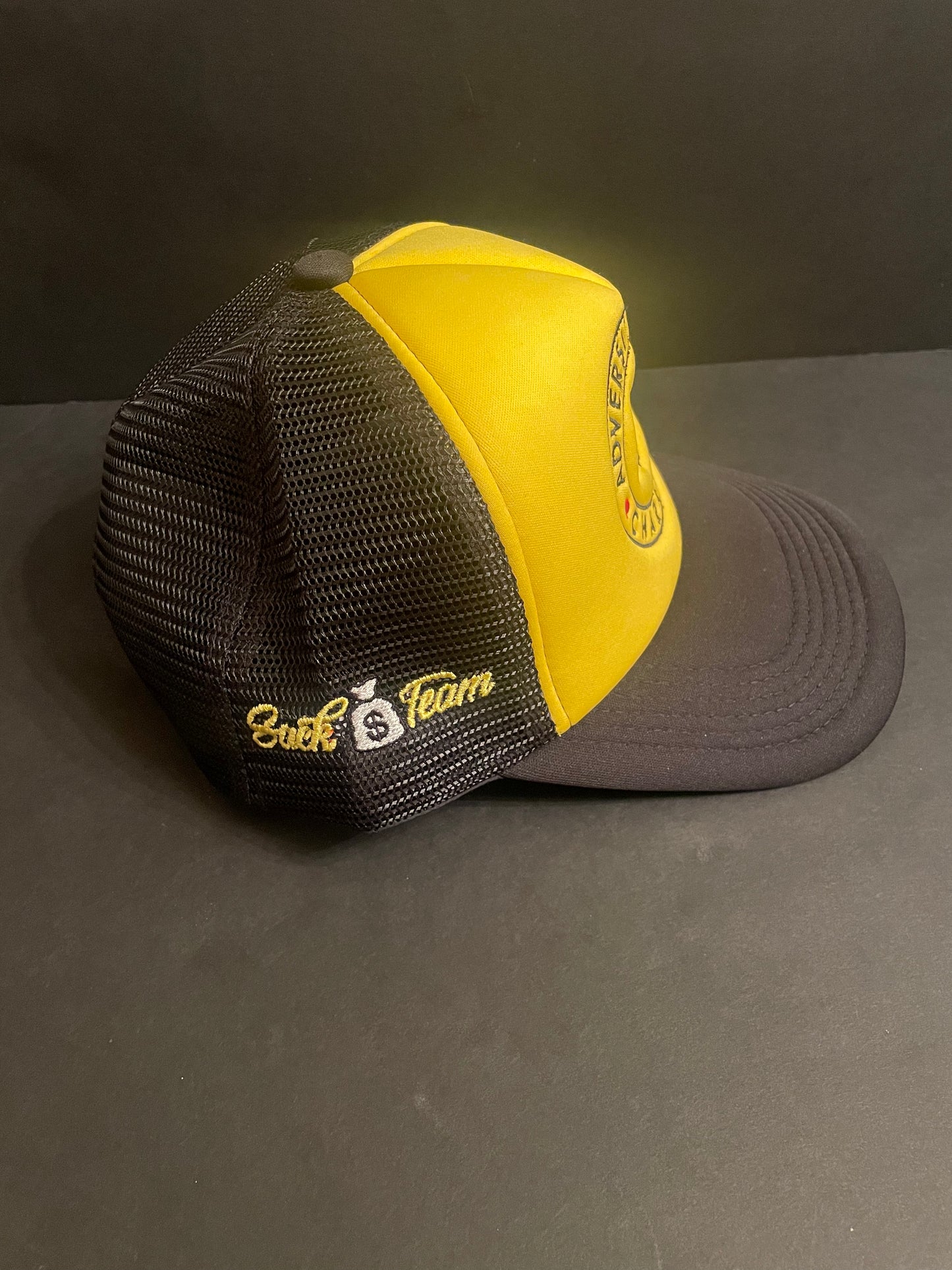 ABC/Sack Team Black/Athletic gold trucker hat